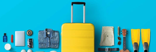 Travel flat lay with perfume bottle, passport, and sunglasses